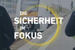 Zug im Hintergrund mit Schrift "Die Sicherheit im Fokus"